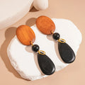 Handmade wooden retro earrings with elliptical design in silver-brown-black colours