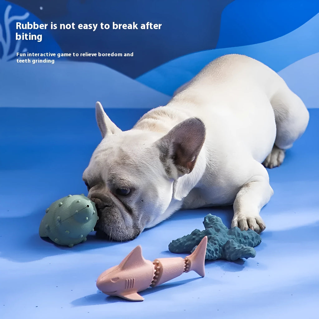 Blue and green deep sea shark shaped rubber dog chew toy for interactive feeding