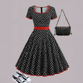 Square collar polka dot dress with pleated skirt and zip front closure in multicolour pattern