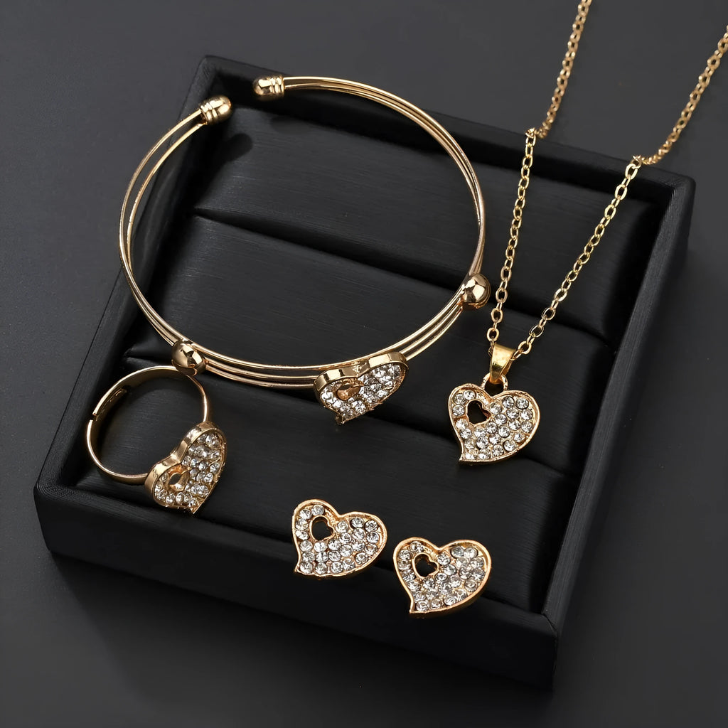 Gold women's jewellery set featuring earrings, an adjustable necklace, and a bracelet with heart, water drop, and bell pendants.