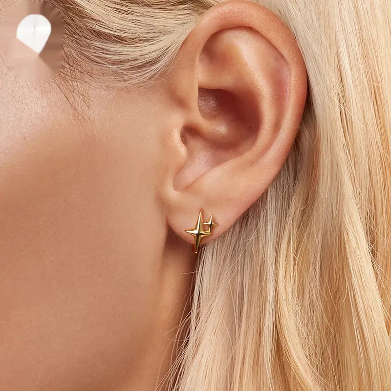 Sterling silver minimalist star ear clips with oxidation treatment and clip-on mechanism