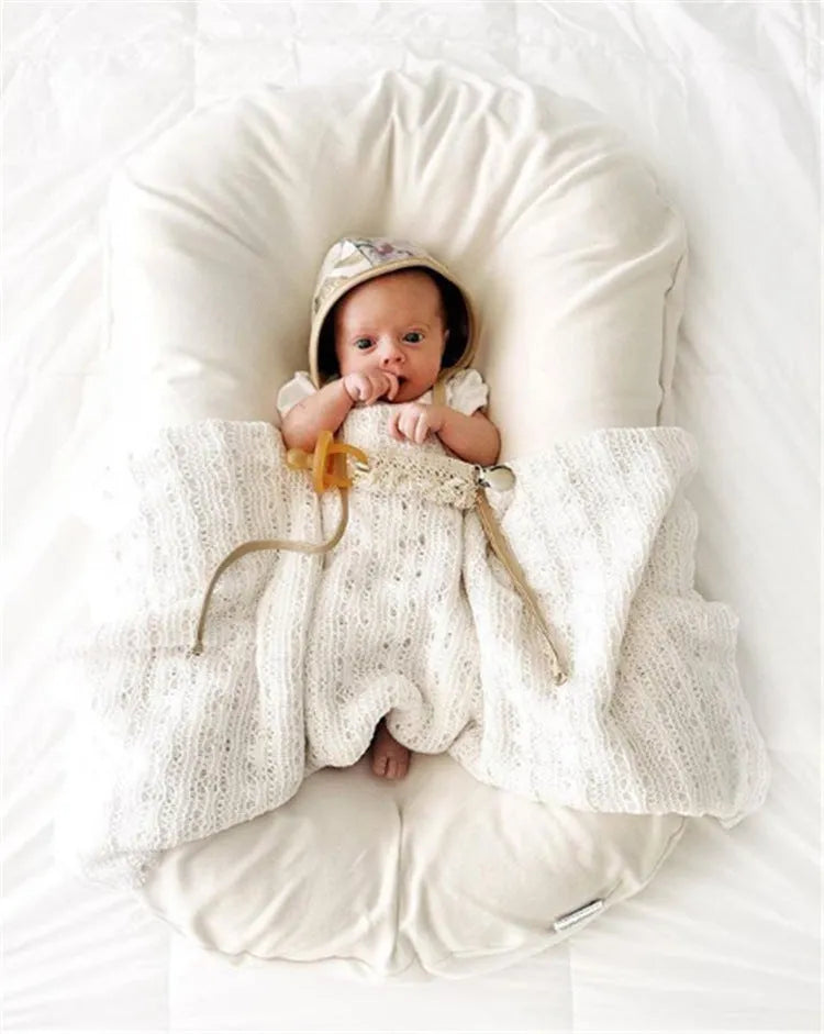Beige portable cotton baby nest crib for newborns measuring 75cm by 45cm