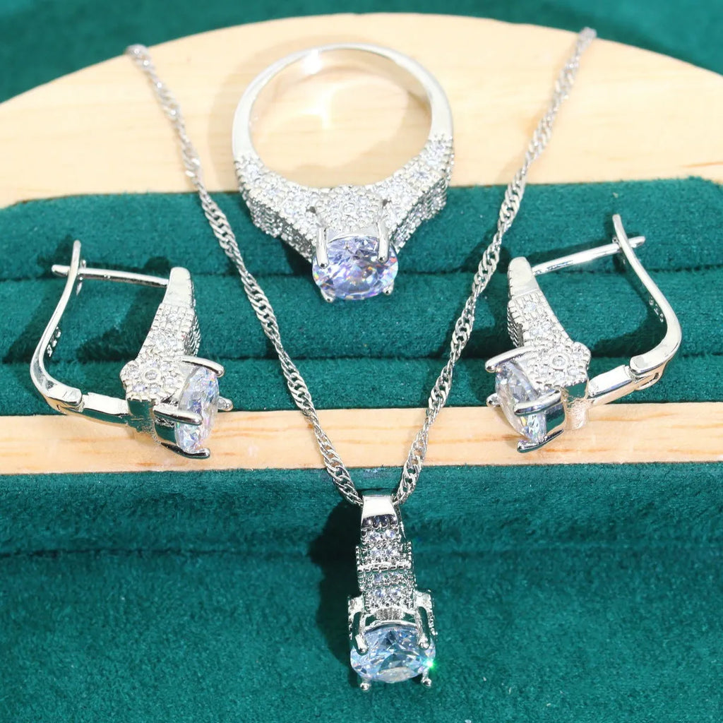 Four-piece bridal jewellery set showing necklace, bracelet, earrings, and ring with water wave chain