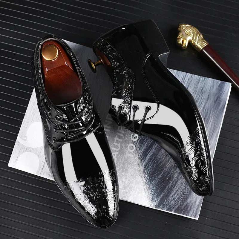 Men's glossy black patent leather formal shoes with pointed toe and carved detail, low top style