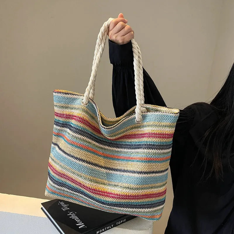 Blue straw woven large shoulder bag with an adjustable nylon strap