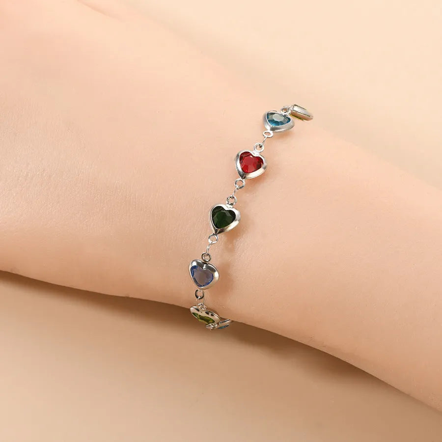 Devil's Eye Creative stainless steel geometric heart bracelet in an electroplated colour on a wrist.