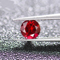 Cultured ruby gemstone in pigeon blood red colour showing different cut styles including round, princess, and water drop