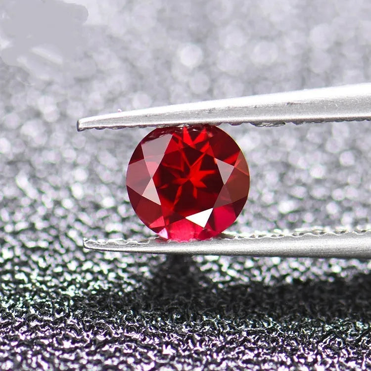 Cultured ruby gemstone in pigeon blood red colour showing different cut styles including round, princess, and water drop