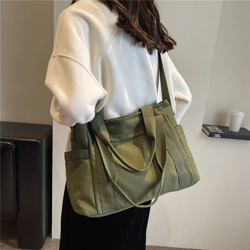 Women's solid colour shoulder bag with large capacity and mobile phone compartment in four colour options