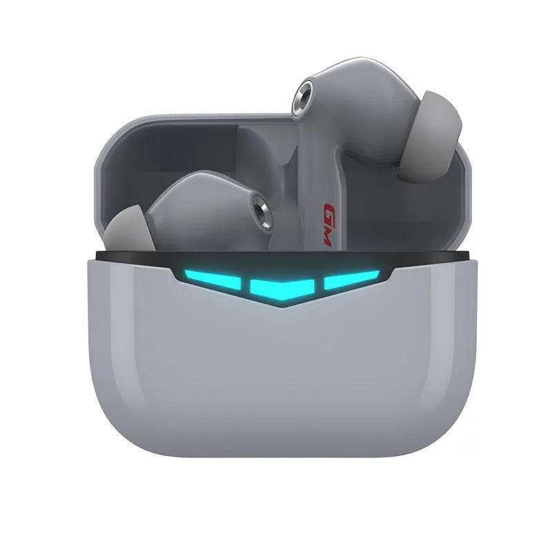 True wireless black gaming earbuds with charging case and spare silicone ear tips.