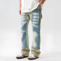 Retro patchwork jeans with splash-ink distressed design in yellow and blue colours