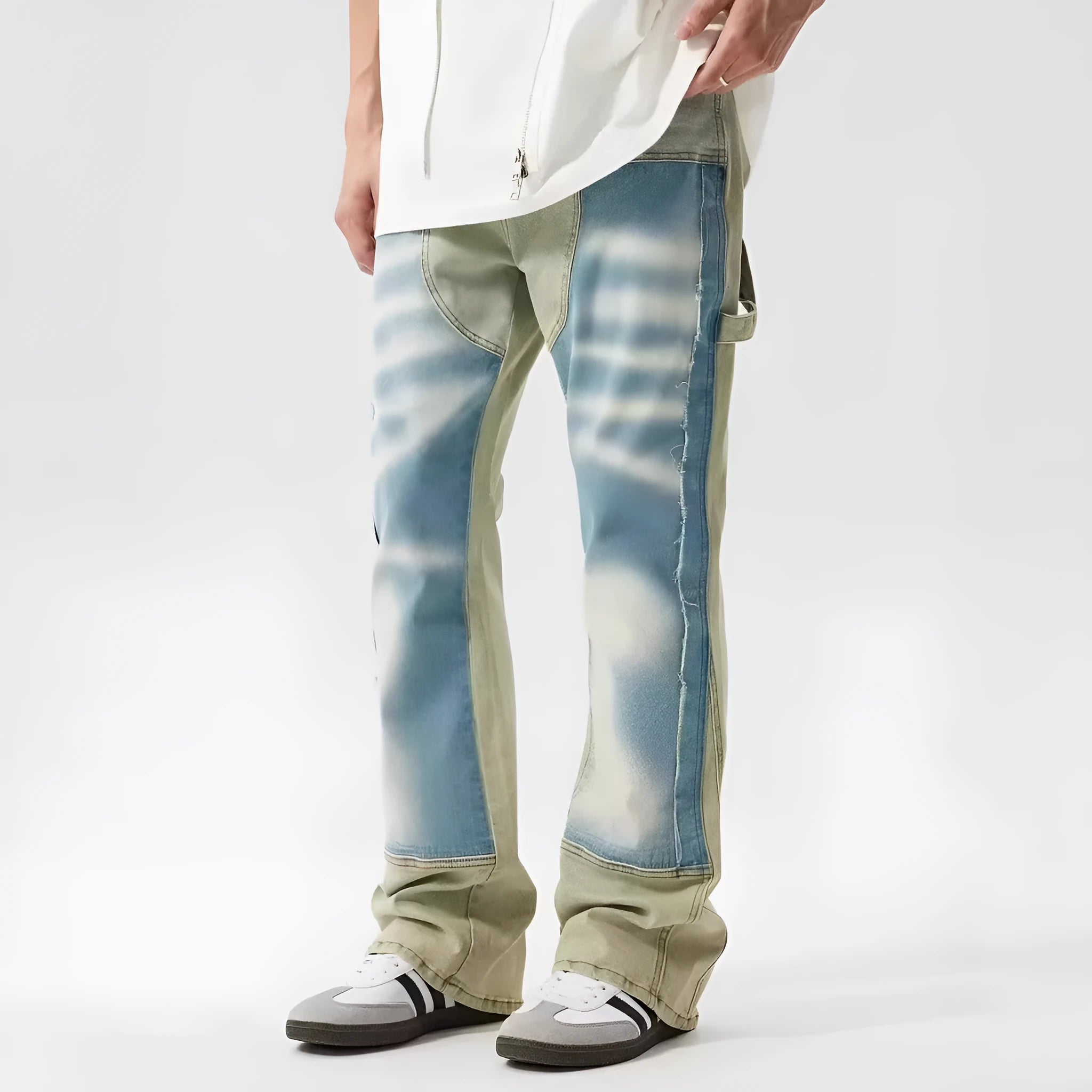 Retro patchwork jeans with splash-ink distressed design in yellow and blue colours
