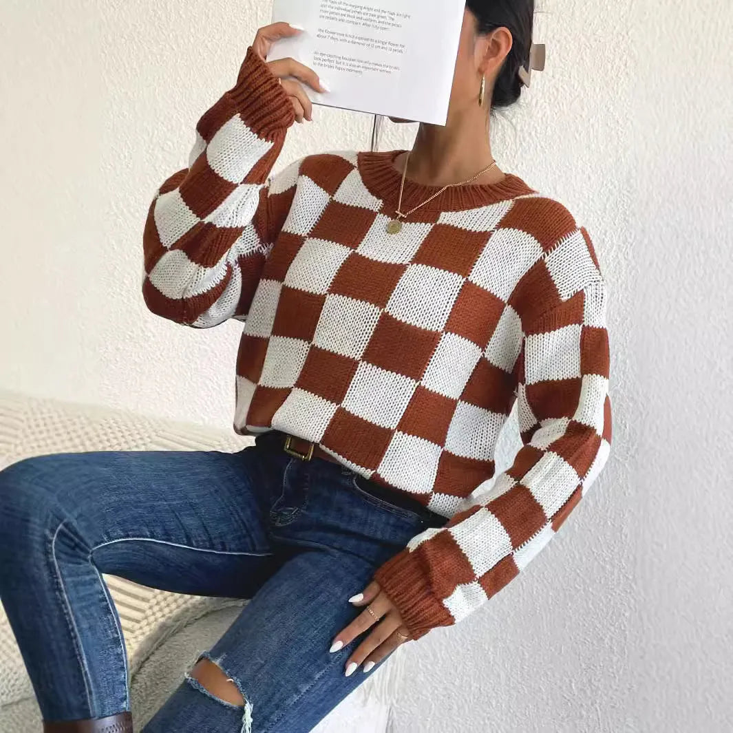 Dark brown plaid pattern acrylic pullover sweater with round neck and long sleeves on hanger