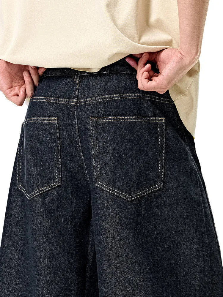Men's wide leg denim trousers in original cow colour showing mid-waist design and cotton denim fabric