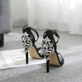 Black women's high heel shoes with rhinestone decorations and a fish mouth toe.