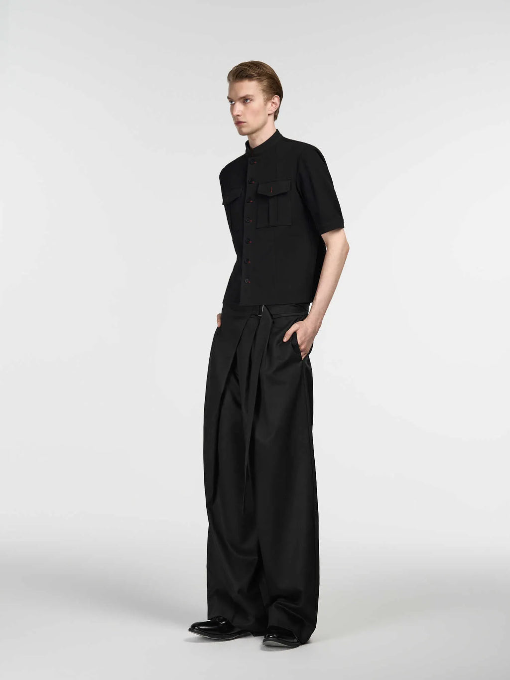Black straight-leg trousers with adjustable waist and single pleat design in Tencel cotton blend fabric