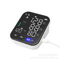 White electronic blood pressure monitor with large screen showing blood pressure and pulse readings
