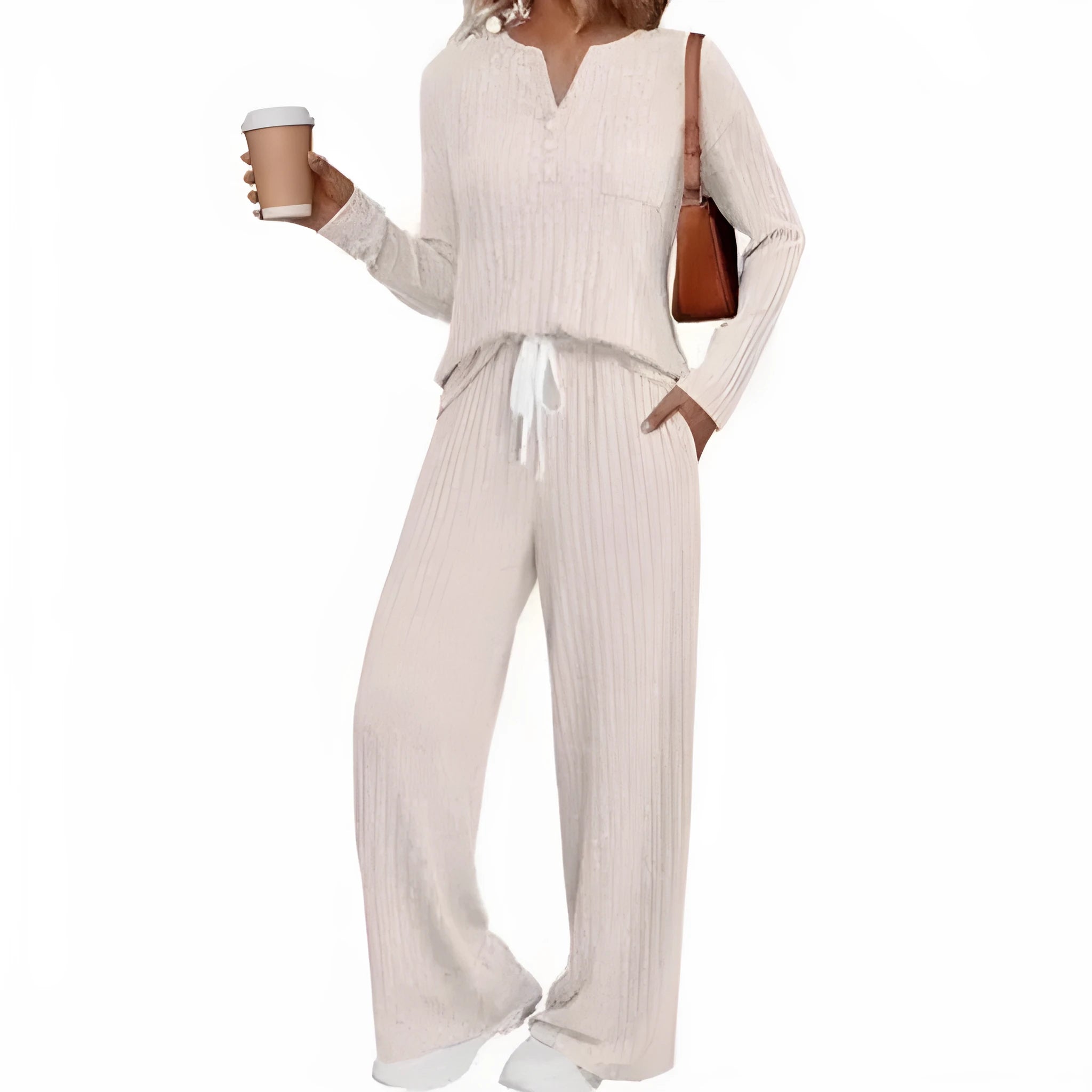 Woman wearing a striped knitted V-neck long coat with matching pants in a light grey colour.