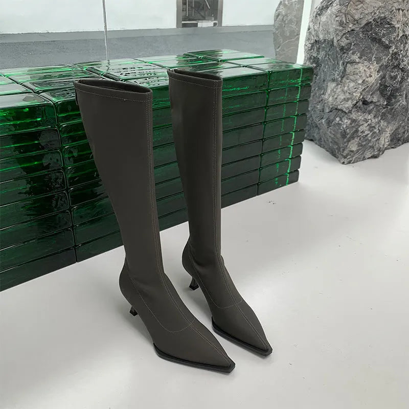 Women's black pointed toe ankle boots with stiletto heel and back zip fastener