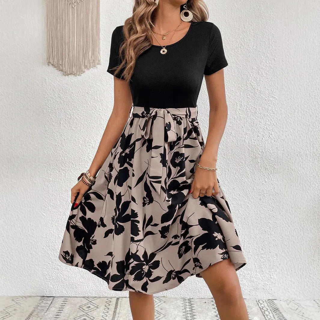 Women's khaki A-line dress with floral pattern, shoulder straps, and lace-up front detail