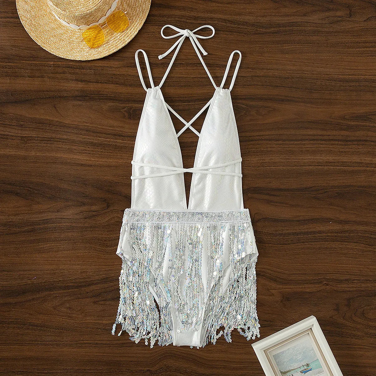 White deep V-neck one-piece swimsuit with tassel detailing for swimming