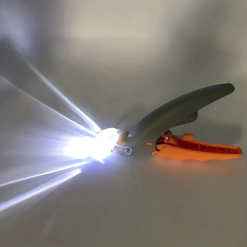 Yellow pet nail trimmer with LED lights, magnifying glass, and comfortable grip for cutting cat and dog claws.