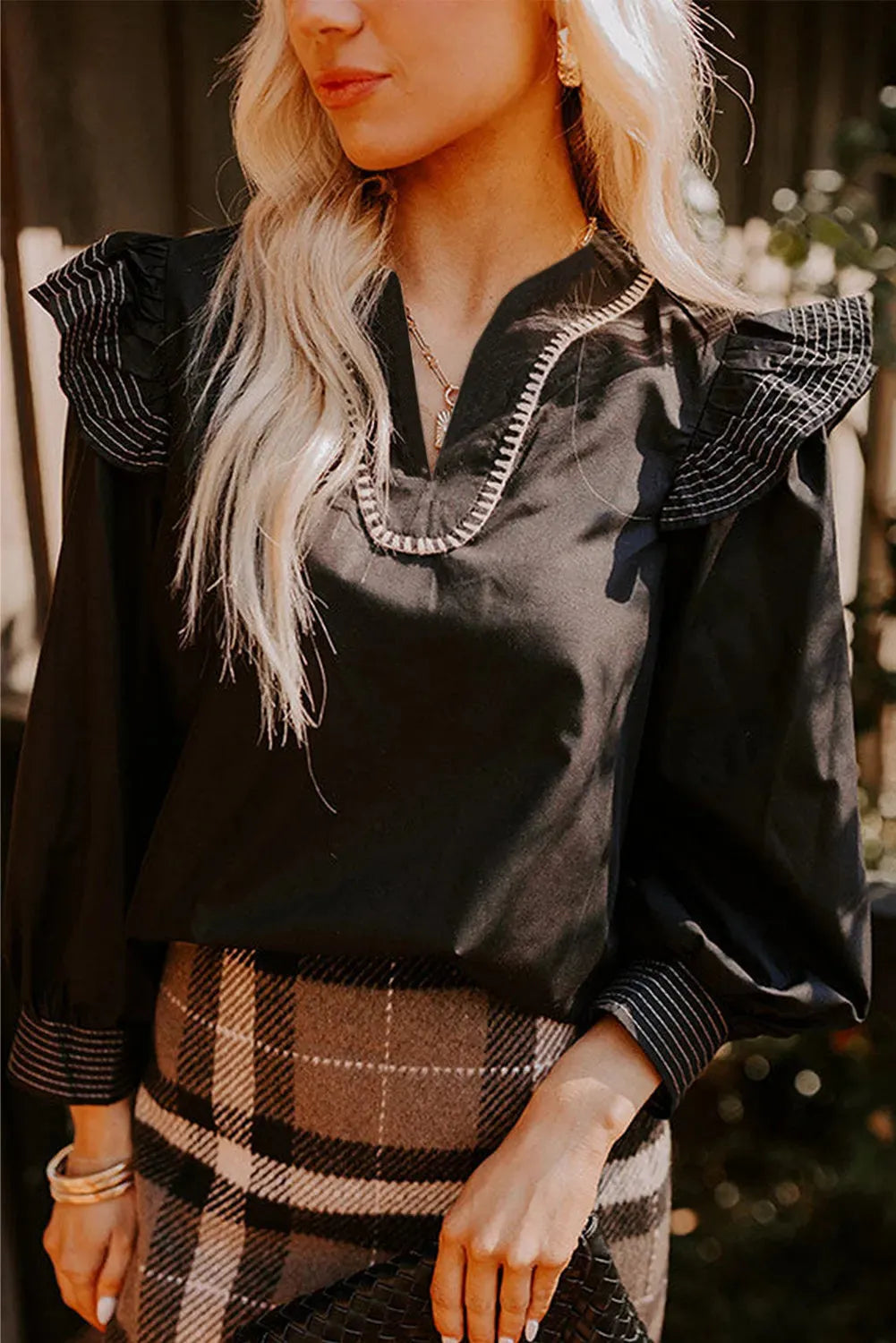 Black women's v-neck blouse with ruffle long sleeves and contrast stitching