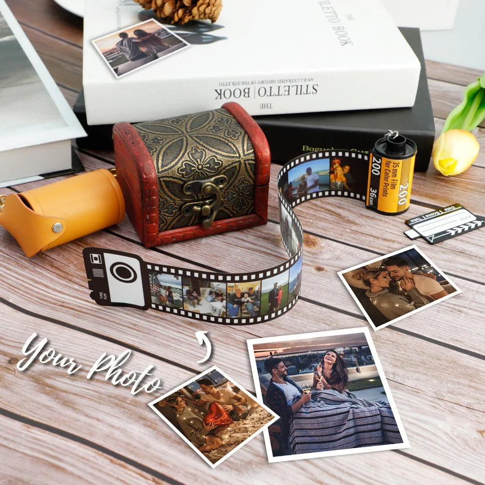 Custom film keychain with ten photographs on a film strip and a rewinder accessory