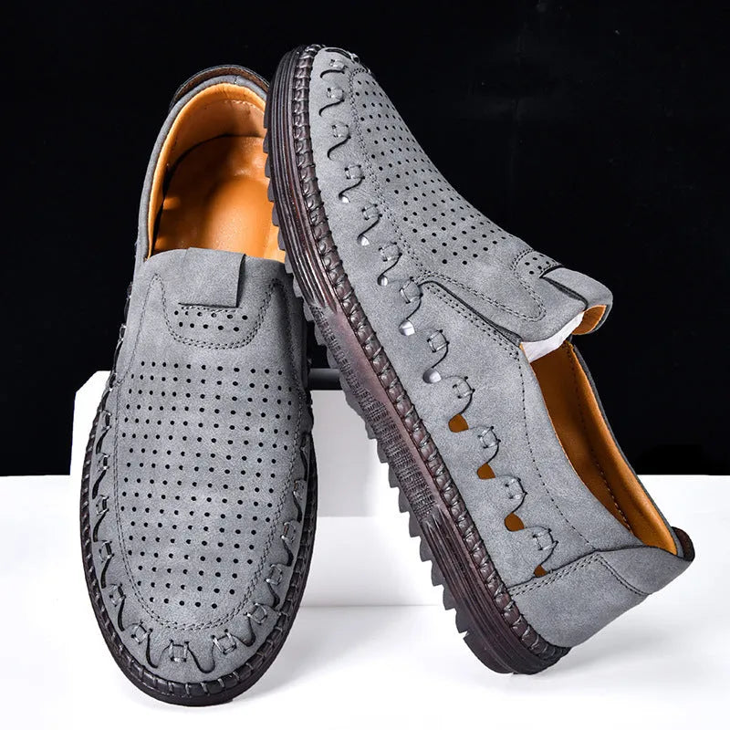 Men's brown slip-on casual shoes with round toe and visible sewing construction on artificial PU upper