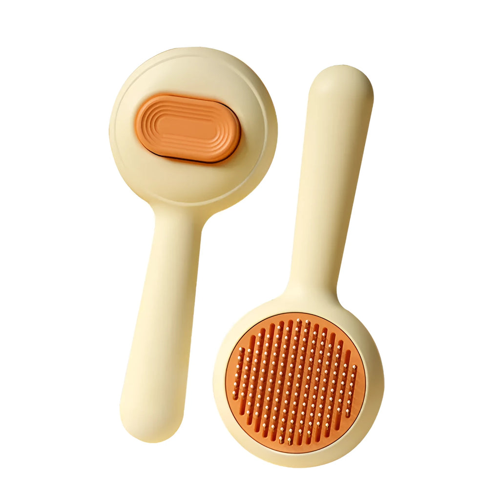 Green stainless steel cat grooming brush with non-slip handle for pet hair removal