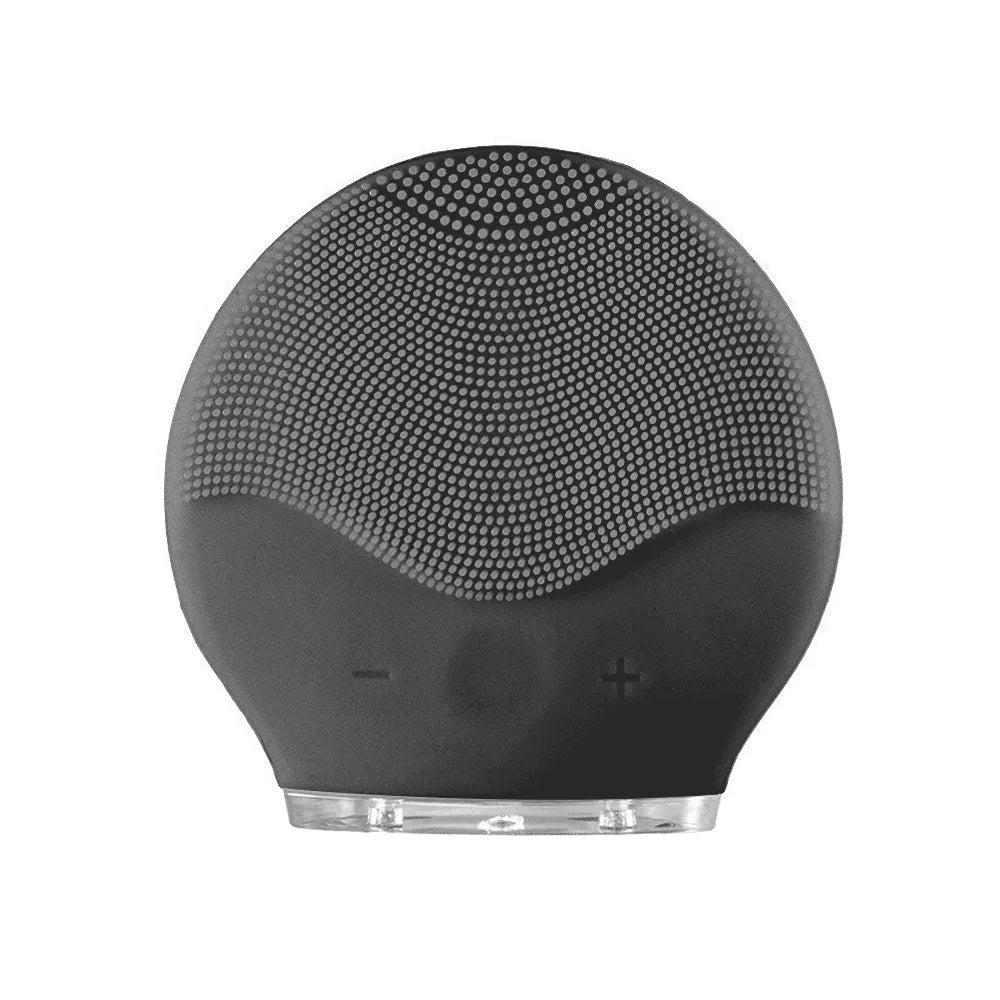 Electric waterproof silicone mini facial cleansing brush in pink with USB charging cable