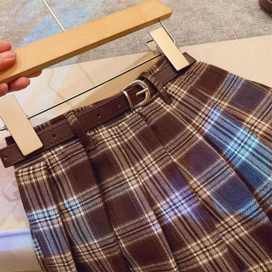 Children's plaid pleated skirt in cotton blend fabric with A-line silhouette available in multiple height options
