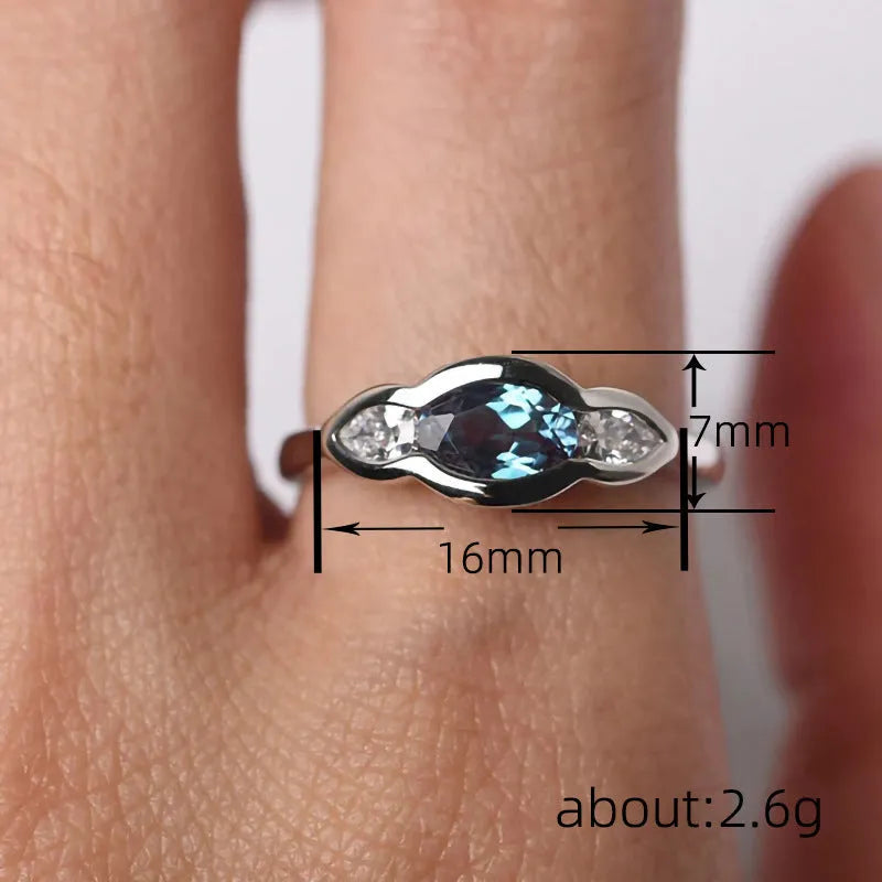 Women's geometric ellipse copper ring with inlaid zircon detail in white gold colour.