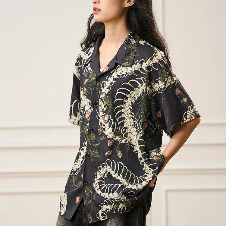 Men's short sleeve Cuban collar shirt featuring a snake bone and floral printed pattern in a loose fit.