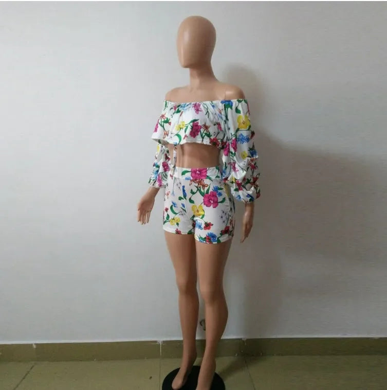 Multicolour digital print two-piece costume with fluffy sleeves and matching shorts.