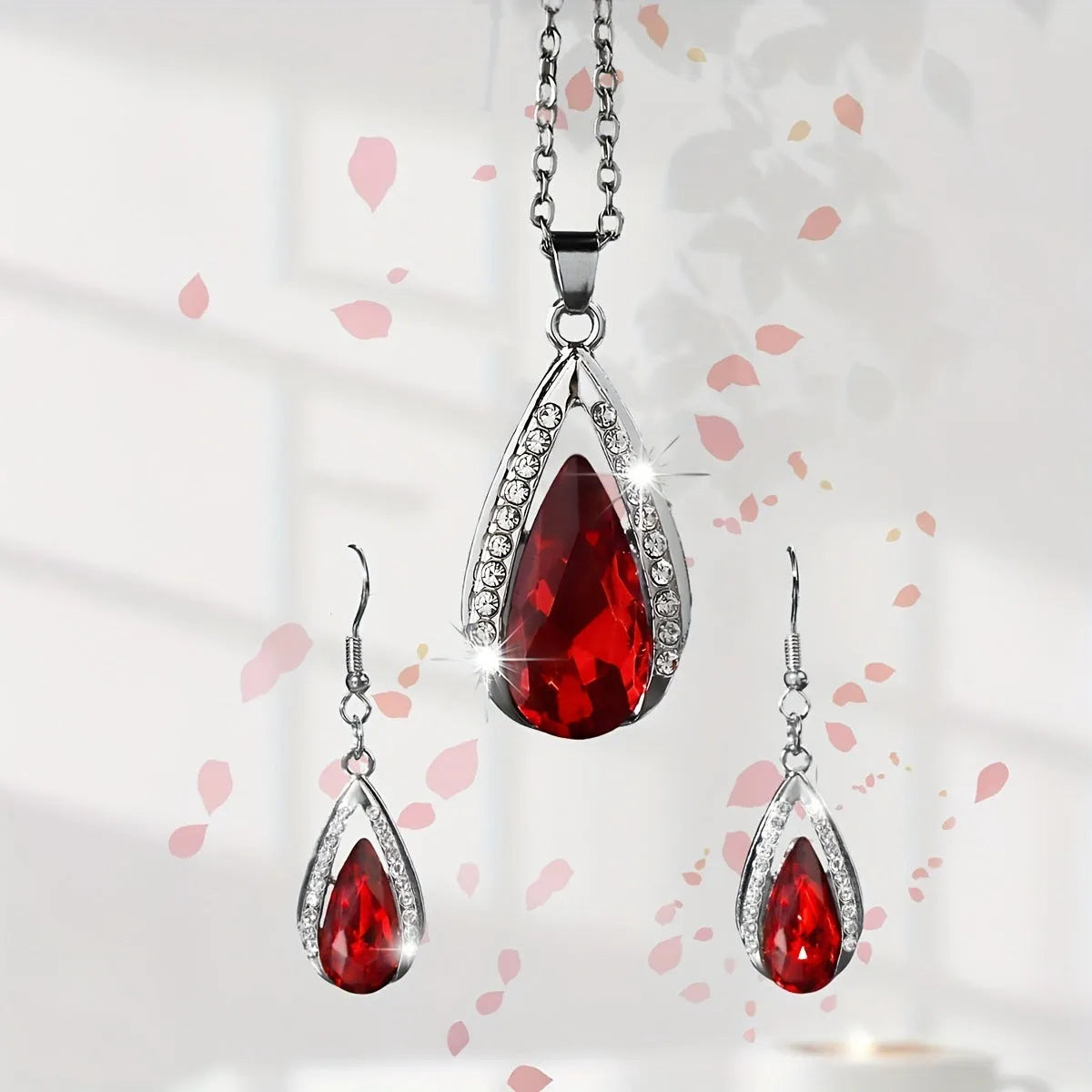 Black and red alloy teardrop pendant necklace with matching earrings set.