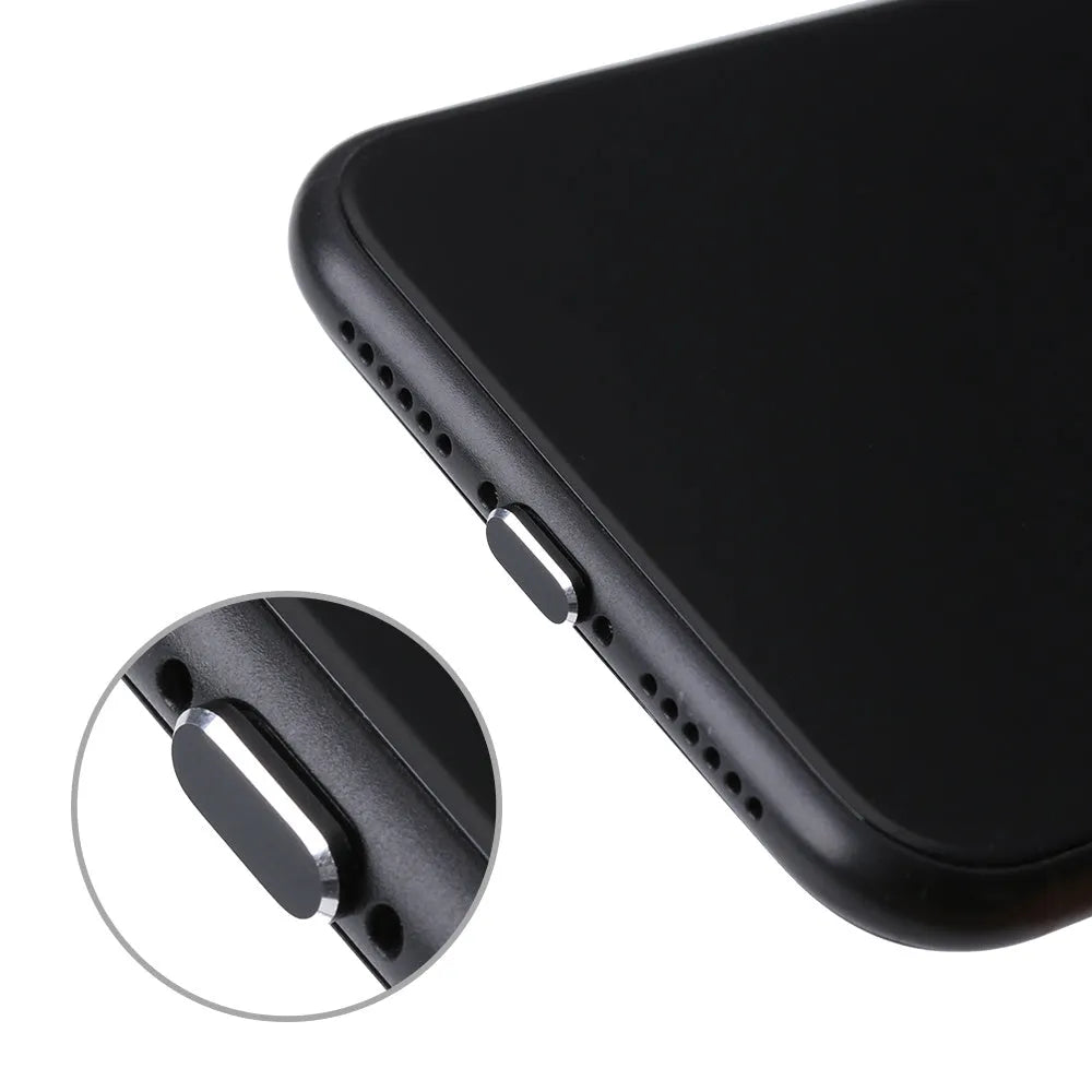 Aluminium alloy iPhone charging port dust plug in metallic colours on a dark background.