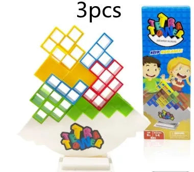Plastic balance stacking game with coloured blocks on chassis for family play