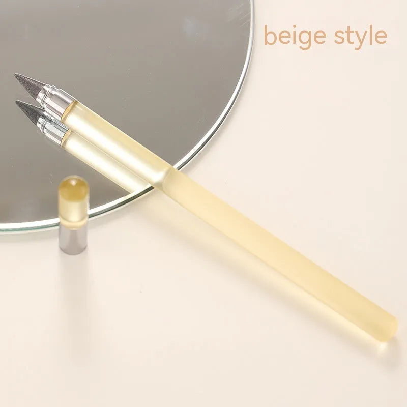 Clear acrylic sharpening-free eternal pencil with alloy tip on a desk