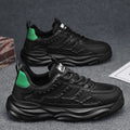 Men's solid colour PU mesh casual trainers in black or white on a white background.
