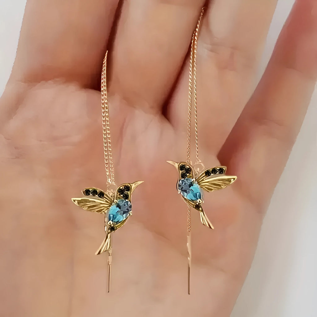 Long style hanging earrings featuring a bird design with mixed zirconium wings in red and blue electroplated alloy