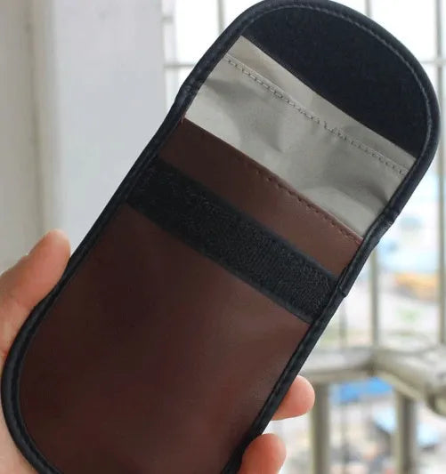 Black microfiber RFID signal blocker pouch for mobile phones and bank cards, measuring 13.5 by 9.5 cm.