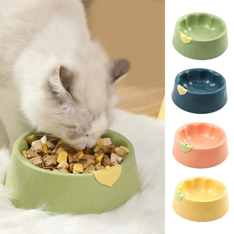 Green plastic double pet bowl with flower shape and separate food and water compartments.