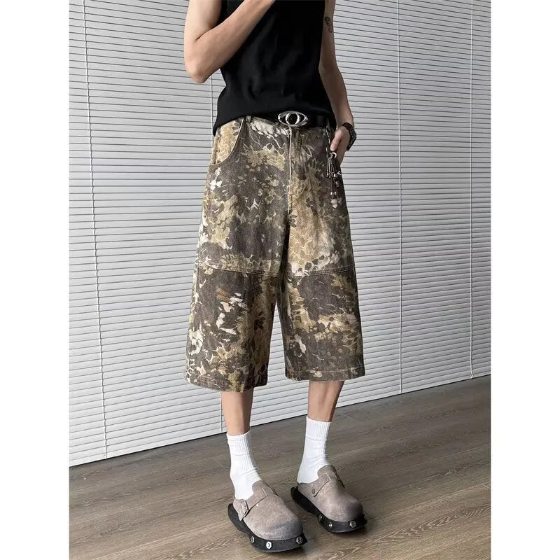 Yellow snake pattern camouflage cropped jeans on a denim background