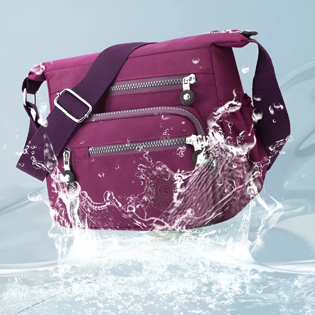 Soft nylon messenger bag in square vertical shape with an adjustable shoulder strap.