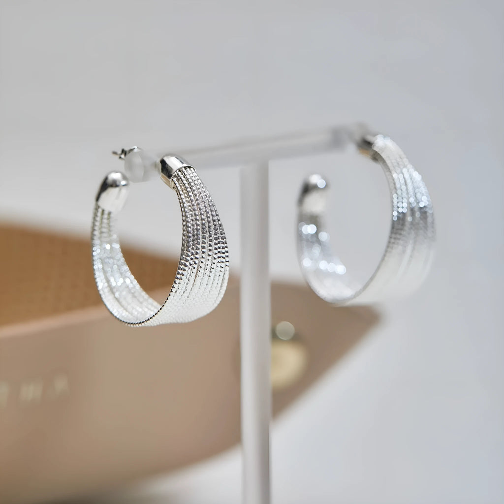 Geometric copper bracelet earrings with electroplated silver or gold finish showing stud and clip styles