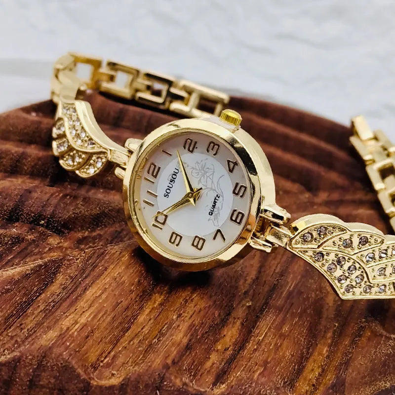 Women's stainless steel watch with a round dial shown in gold, black and gold, and white and gold colour options