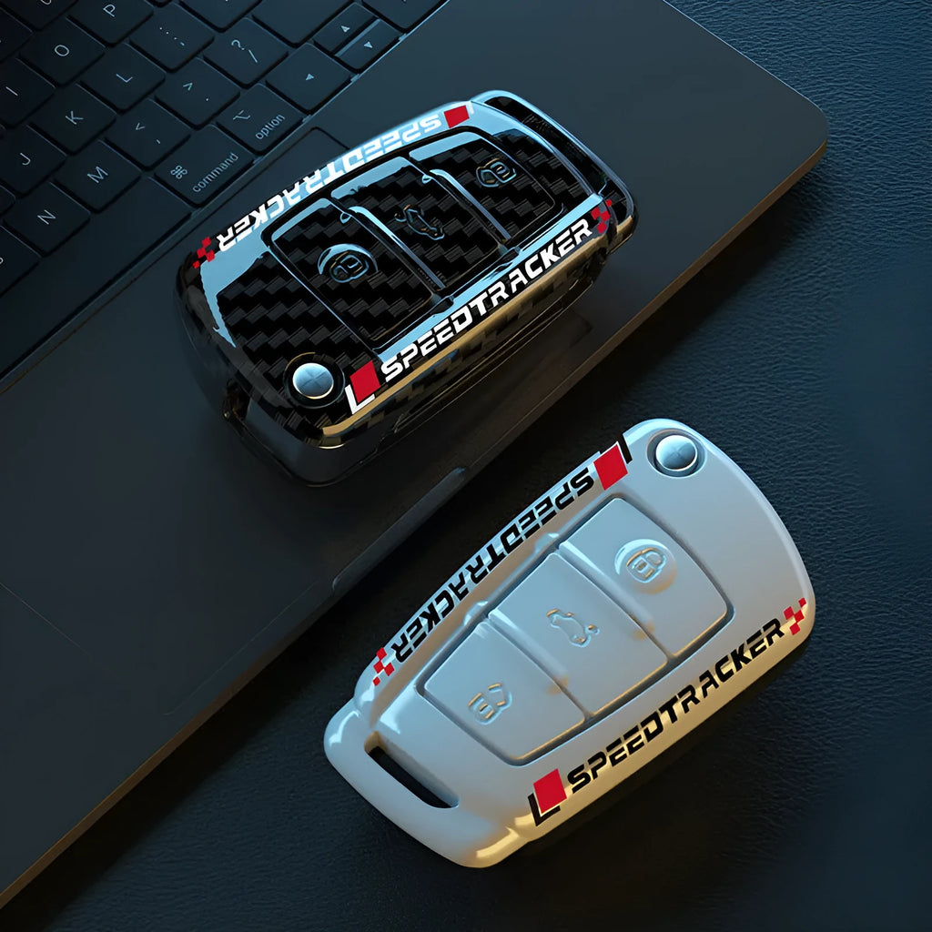Carbon fibre style car key cover with a small mirror, shown in black and white colour options.
