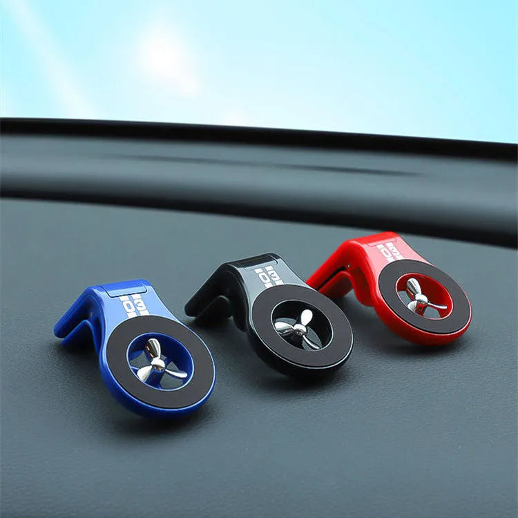 Black magnetic car air vent phone holder with adjustable mount and fragrance slice compartment.