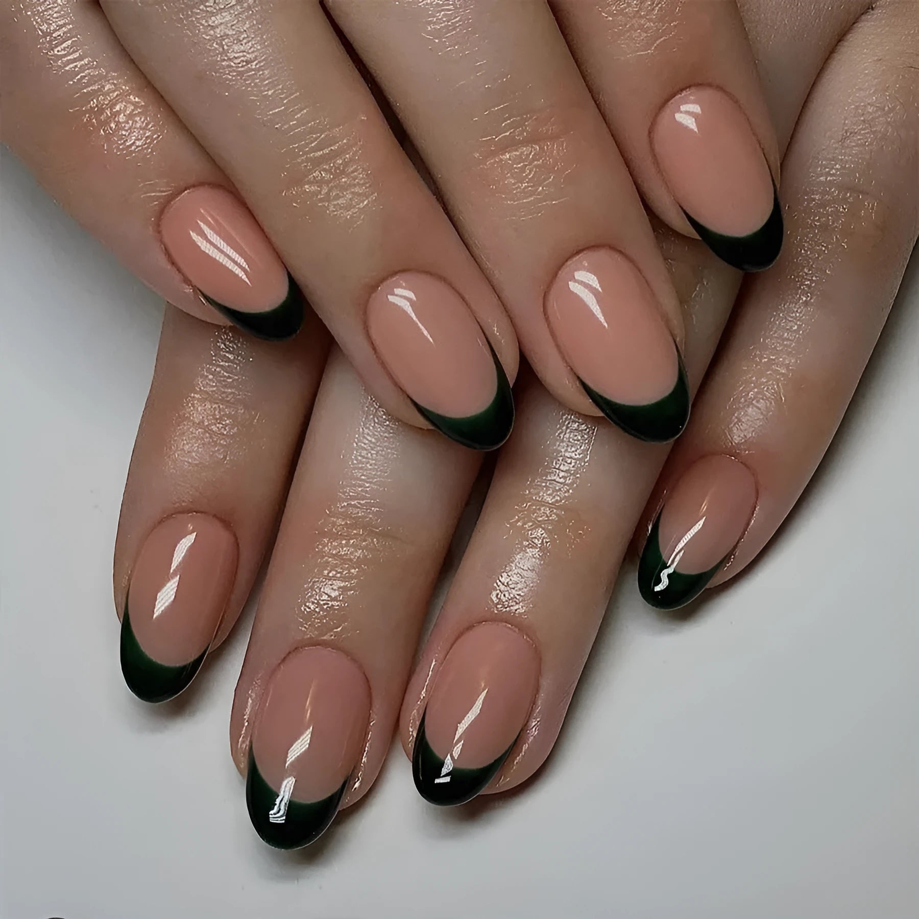 Black French style false nails set with 24 almond-shaped pieces in J049 colour classification